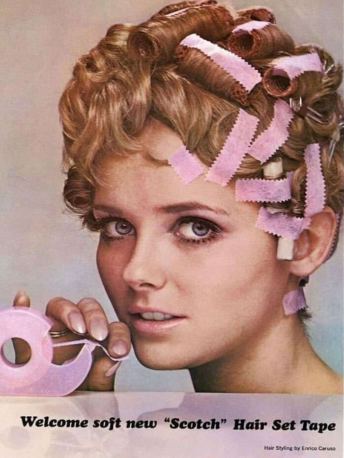 Vintage woman with curlers in hair using Scotch hair set tape, reflecting June Cleavers vintage closet style.
