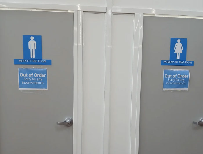 Men's and women's fitting rooms at Walmart with out of order signs, illustrating wild times Walmart employees faced at work.