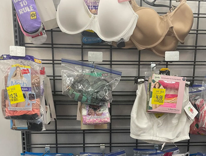 Clearance bras and underwear displayed in plastic bags at Walmart, illustrating wild times Walmart employees faced at work.