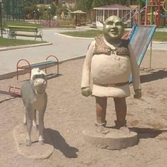 Cursed playground statues resembling cartoon characters, featuring unsettling and distorted designs disturbing fans daily.