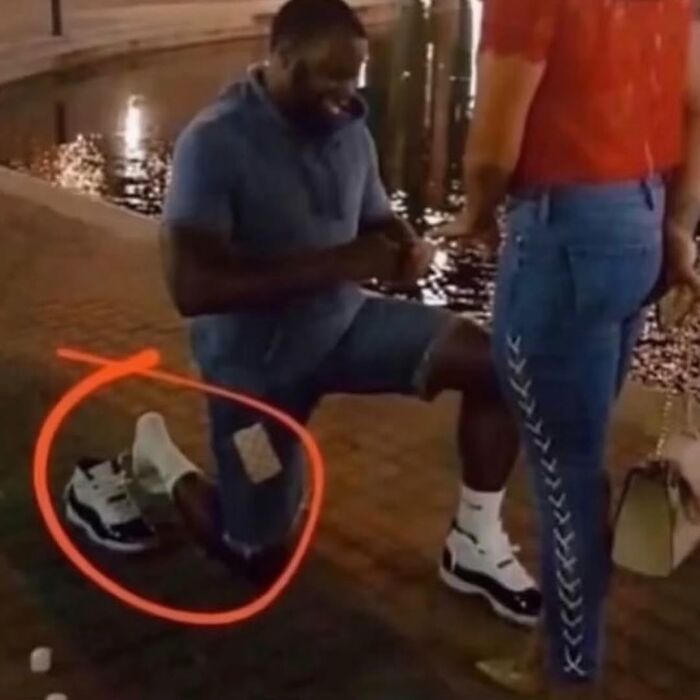 Man proposing while missing a shoe circled, showcasing a cursed image from an IG page disturbing 200K fans daily.
