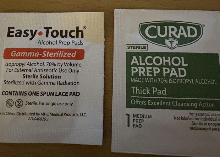 Two alcohol prep pads side by side, showing sterilized antiseptic pads used in family health routines.