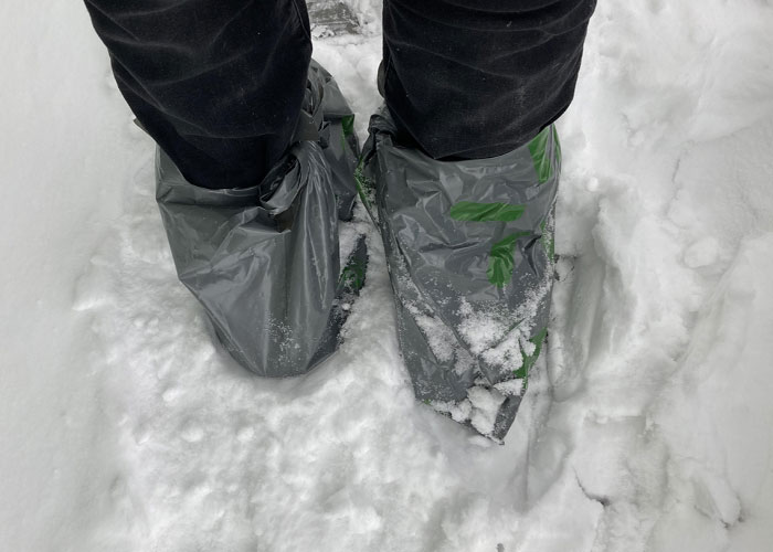 Feet covered in plastic bags to protect from snow, showing one of the 93 things people assumed everyone did in their family.