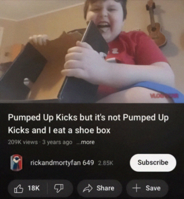 Child laughing while holding and biting a shoebox, a meme for those with a broken sense of humor.