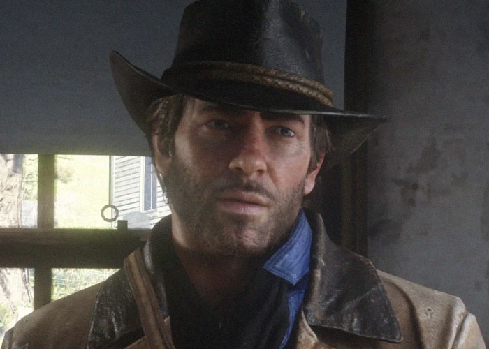 Close-up of a man in a worn leather jacket and hat, illustrating tension related to woman checking boyfriend&rsquo;s phone.