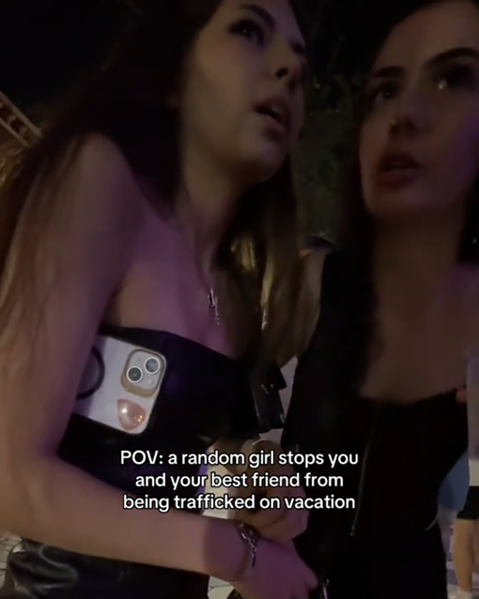 Two women at night with urgent expressions, highlighting woman issues urgent warning about trafficking on vacation. Two women at night with urgent expressions, highlighting woman issues urgent warning about trafficking on vacation.
