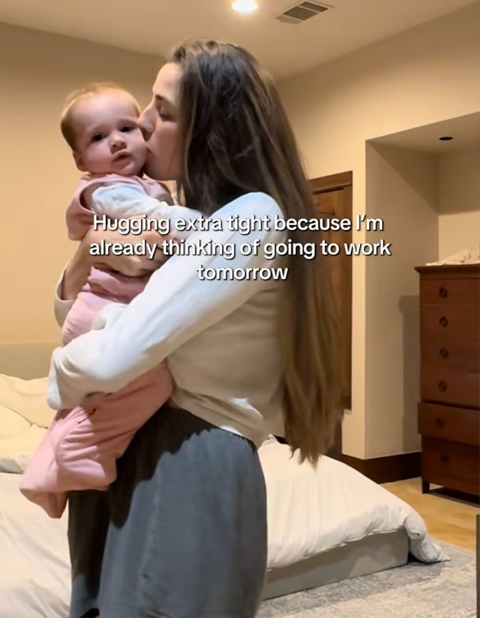Woman hugging baby tightly, expressing emotions of a working mom in the U.S. before going to work tomorrow. Woman hugging baby tightly, expressing emotions of a working mom in the U.S. before going to work tomorrow.