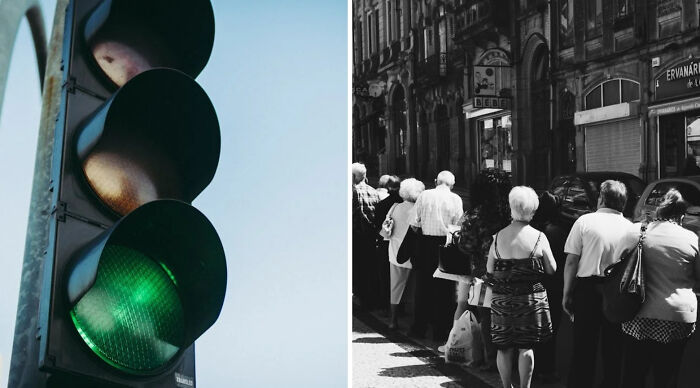Green traffic light illuminated next to a group of people standing in a queue on a sunny city street in the would you rather poll.