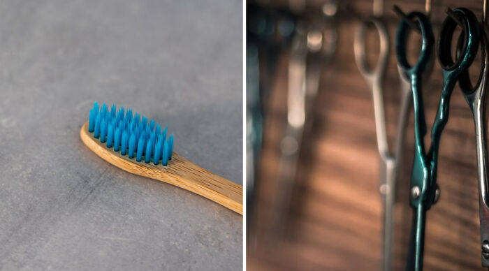 Bamboo toothbrush with blue bristles on left, hair cutting scissors hanging on the right in a blurred background.