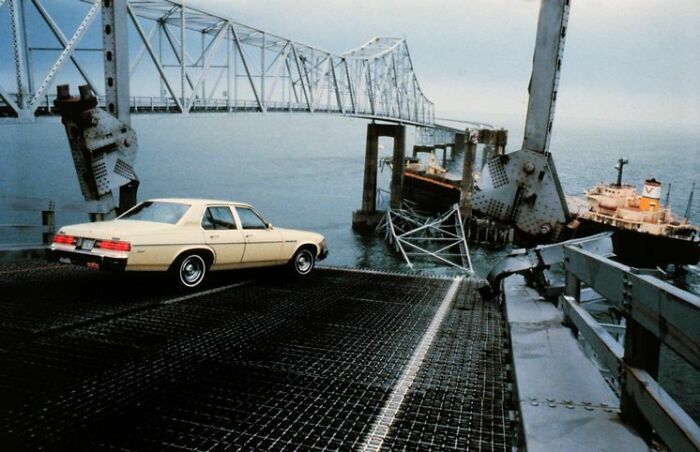 Old beige car stopped at the edge of a collapsed steel bridge over water, illustrating terrifying true stories.