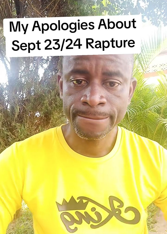 Man in a yellow shirt outdoors with a serious expression apologizing about the RaptureTok prediction falling flat.