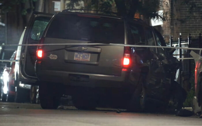 Damaged vehicle at night with rear lights on and police presence, related to maniac driver shocking response incident. Damaged vehicle at night with rear lights on and police presence, related to maniac driver shocking response incident.