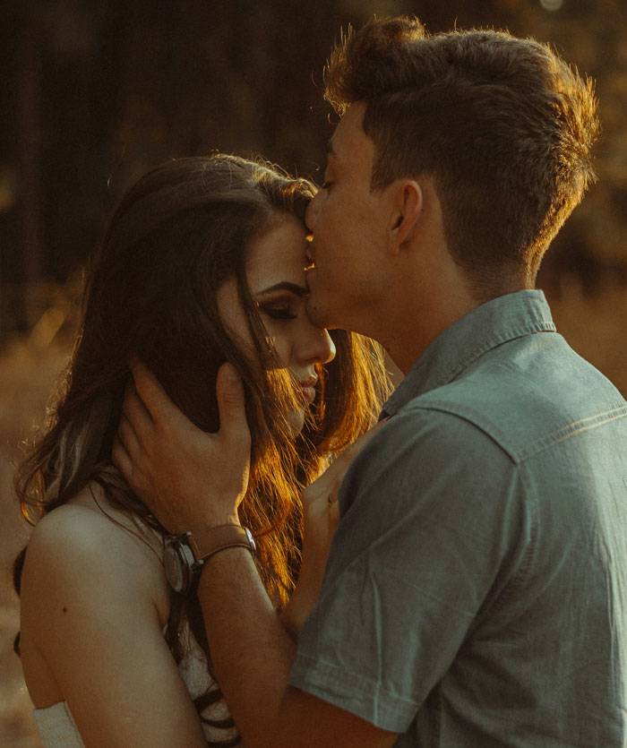 Woman and her model boyfriend share a tender moment, highlighting the theme of being out of her league in love.