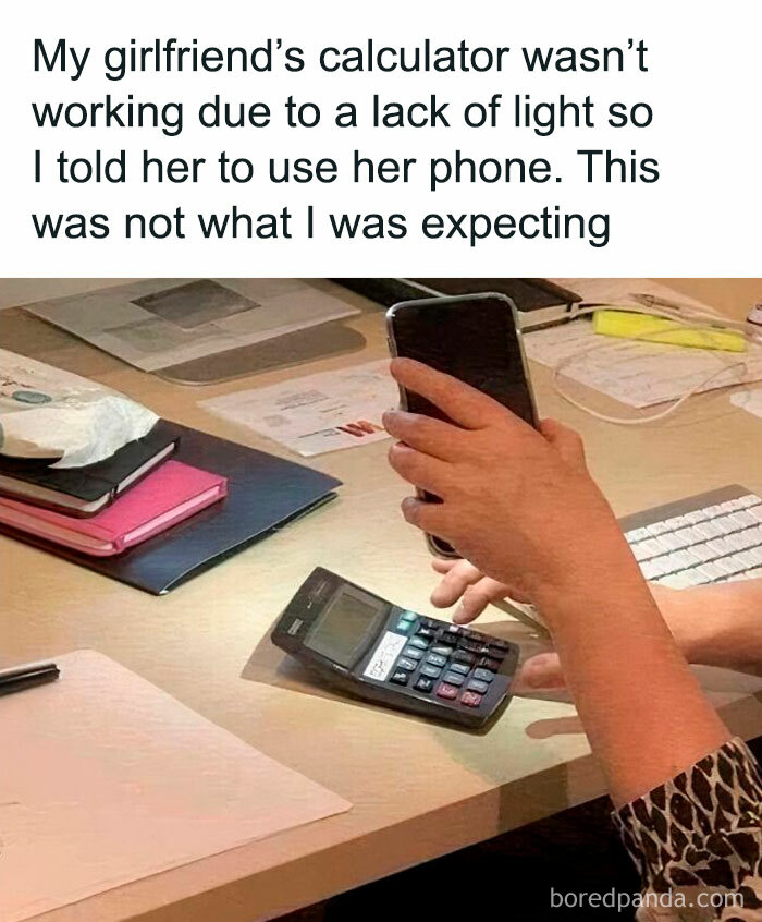 Student using phone as a light source for calculator, illustrating the best and worst life moments of young adults.