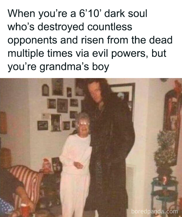 Tall man in dark coat with grandma, a cringe-worthy but wholesome moment showing contrasting personalities.