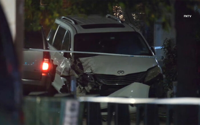 Damaged white Toyota SUV behind police tape at night scene related to maniac driver incident after hitting teen. Damaged white Toyota SUV behind police tape at night scene related to maniac driver incident after hitting teen.