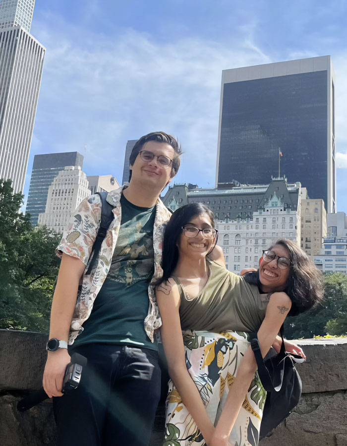 Conjoined twin Carmen Andrade with husband smiling outdoors in city setting, addressing backlash about intimate life.