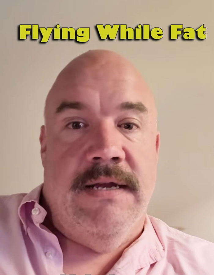 Bald man with mustache in pink shirt discussing flying while fat and plus-size passenger attacks on a flight seatmate. Bald man with mustache in pink shirt discussing flying while fat and plus-size passenger attacks on a flight seatmate.