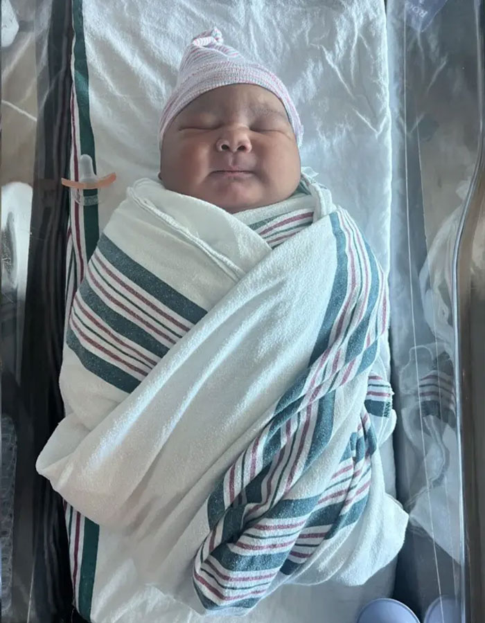 Newborn giant baby wrapped in hospital blanket, highlighting doctors sounding alarm over rise in giant baby births. Newborn giant baby wrapped in hospital blanket, highlighting doctors sounding alarm over rise in giant baby births.