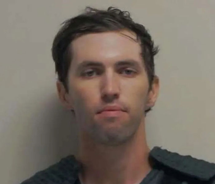 Man with dark hair and gray sweater in a neutral background, related to Tyler Robinson's trans partner disappearance case. Man with dark hair and gray sweater in a neutral background, related to Tyler Robinson's trans partner disappearance case.