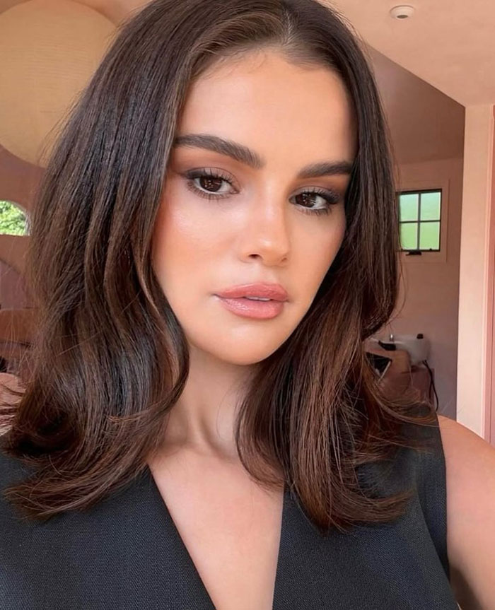 Close-up of a woman with styled dark hair and natural makeup, related to Selena Gomez's mom snubbed at wedding news. Close-up of a woman with styled dark hair and natural makeup, related to Selena Gomez's mom snubbed at wedding news.