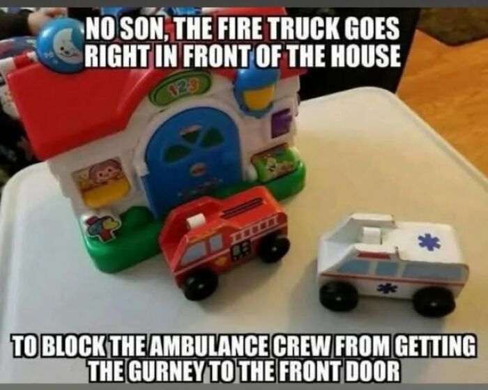Toy fire truck and ambulance positioned to humorously block access, highlighting EMT and paramedic humor in a playful scene.