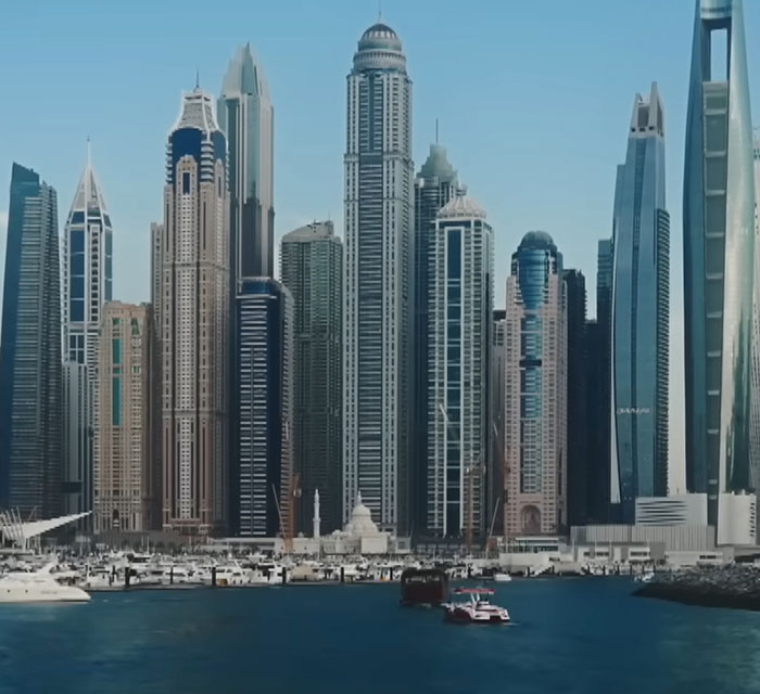 Dubai skyline with modern skyscrapers and boats on the water highlighting the city related to porta potty parties topic