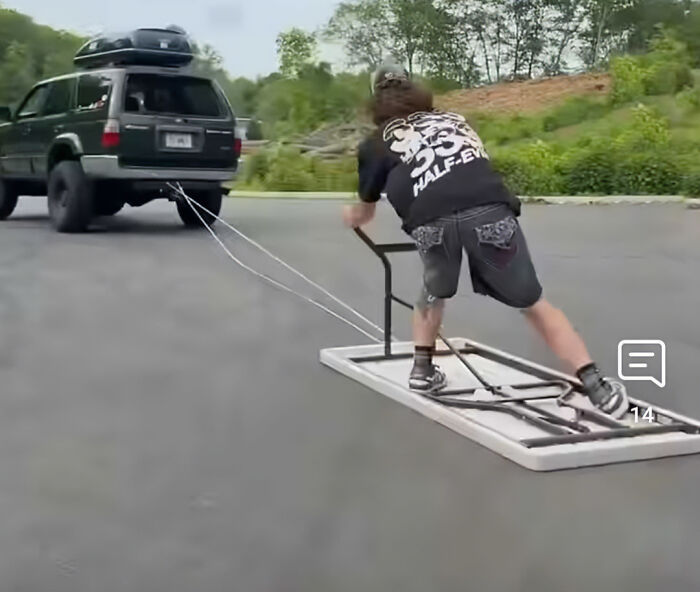 Teen riding door being towed by SUV, highlighting dangers of viral TikTok trend causing catastrophic injuries.