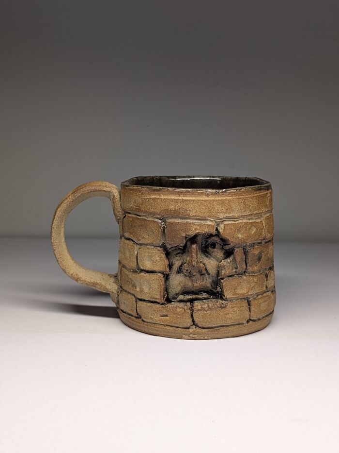 Face In The Bricks Mug By Adam Rush