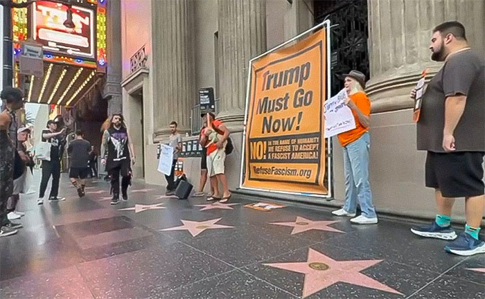 Protesters on Hollywood Walk of Fame holding signs as part of reaction to Jimmy Kimmel show suspension controversy. Protesters on Hollywood Walk of Fame holding signs as part of reaction to Jimmy Kimmel show suspension controversy.