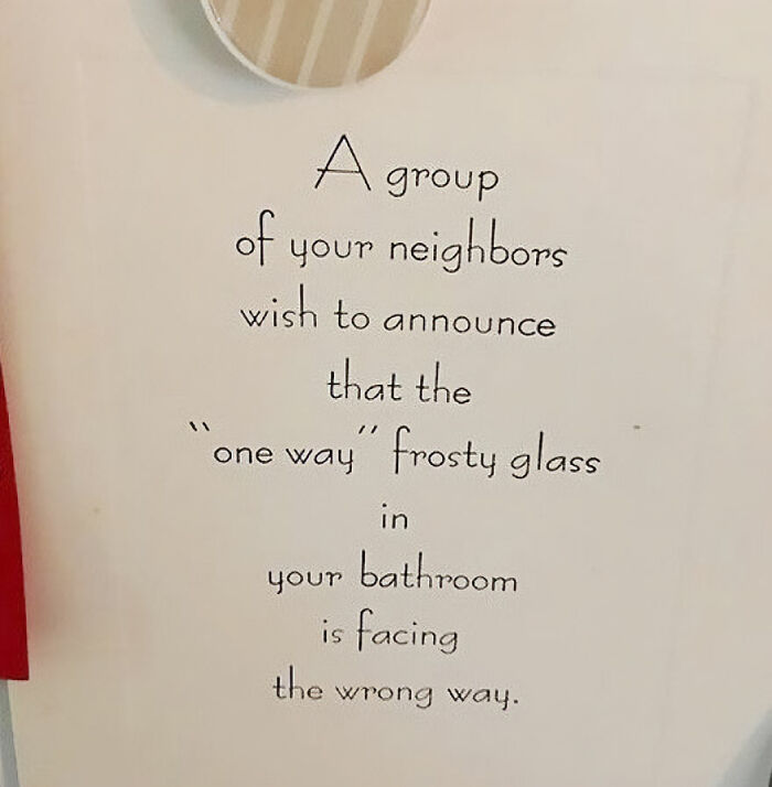 Handwritten note from neighbors about a bathroom frosty glass facing the wrong way, highlighting unbearable neighbors.