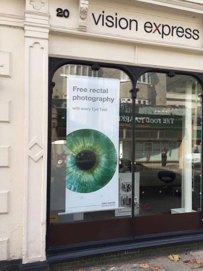 Poster offering free "rectal photography" instead of eye photography, showcasing a social media marketing fail by a company.