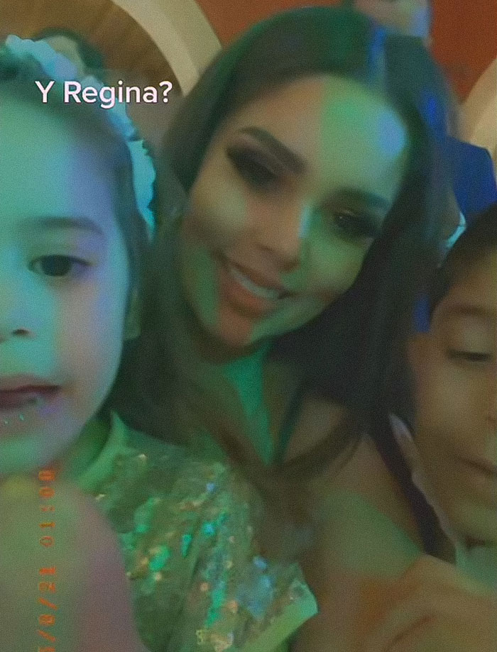 Influencer Esmeralda Ferrer Garibay with her husband and kids in a low-light, candid family photo. Influencer Esmeralda Ferrer Garibay with her husband and kids in a low-light, candid family photo.
