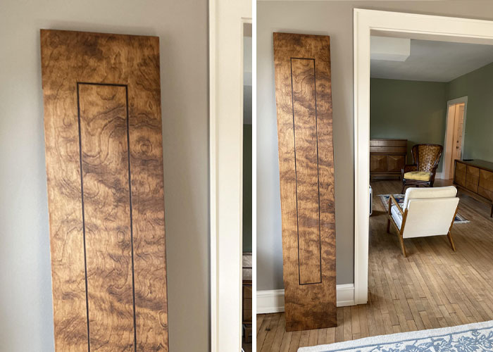 Long wooden panel with a hidden compartment discovered as a hidden gem after moving into a new home.