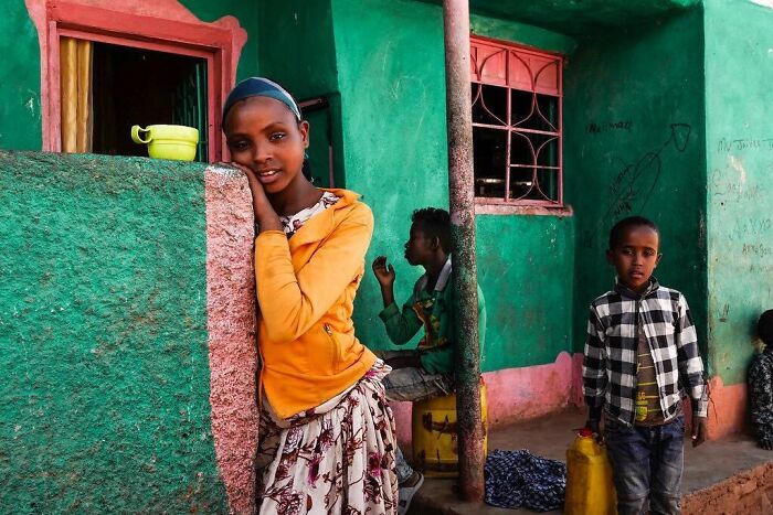 Children of the world photographed outdoors by Andrea Torrei, showcasing vibrant colors and diverse expressions in daily life.