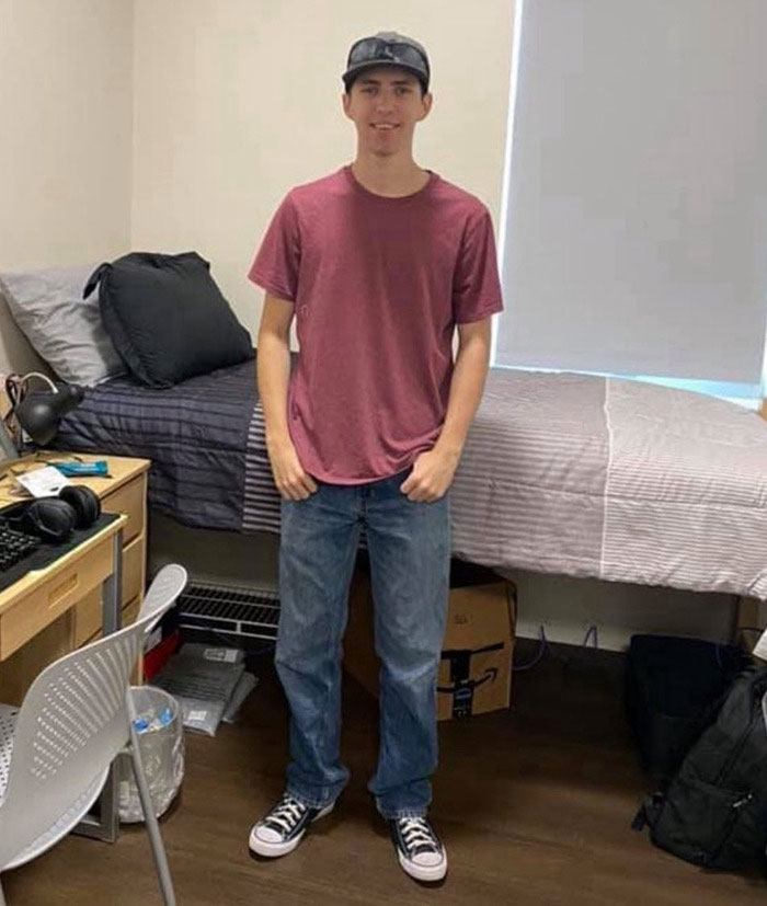 Young man standing in a bedroom, casual attire, representing Tyler Robinson's trans partner disappearance and neighbors' response. Young man standing in a bedroom, casual attire, representing Tyler Robinson's trans partner disappearance and neighbors' response.