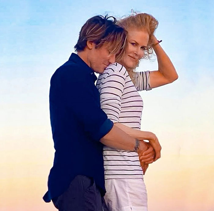 Nicole Kidman and Keith Urban embracing outdoors at sunset, hinting at relationship clues experts revealed.