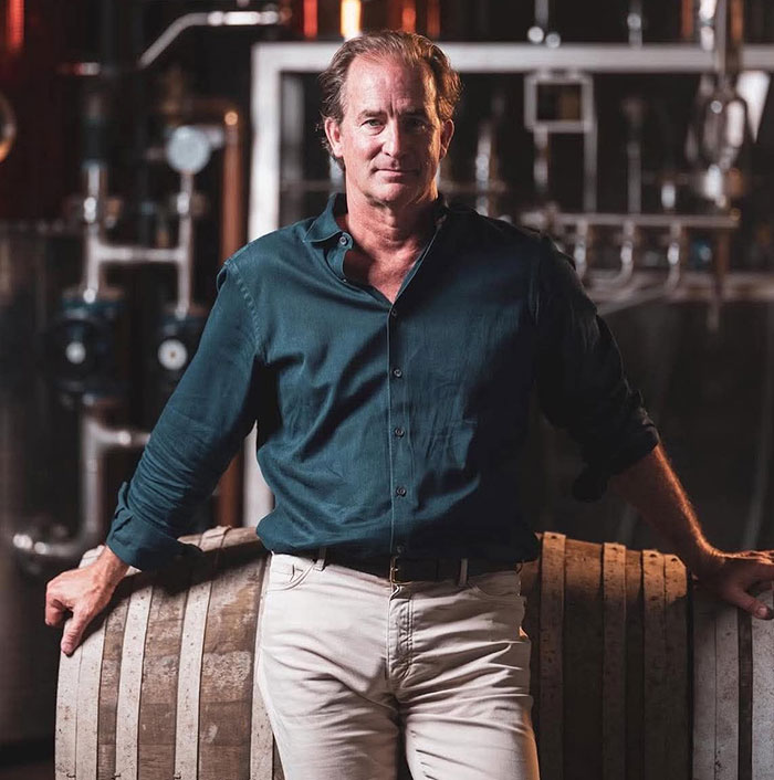 Man standing in a distillery setting, breaking his silence amid divorce related to woman caught with CEO at concert. Man standing in a distillery setting, breaking his silence amid divorce related to woman caught with CEO at concert.