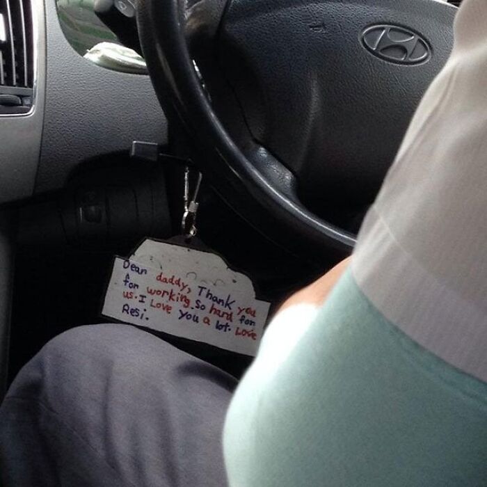 Handwritten thankful note from child hanging in a Hyundai car, capturing a wholesome moment to distract from world horrors.
