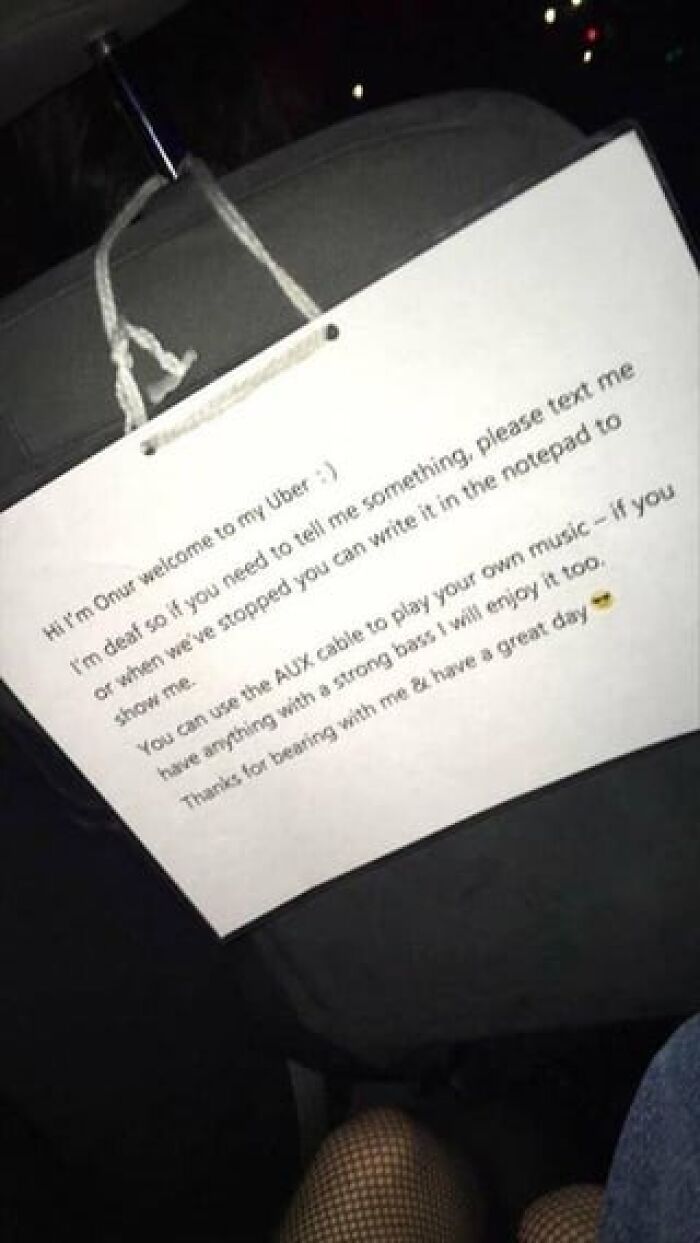 Sign in a car welcoming passengers with a wholesome note offering music and support for a positive ride experience.