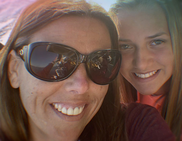 Teen girl and boyfriend tormented by sick catfish, with obsessed mom revealed as the culprit in a close selfie of two females.