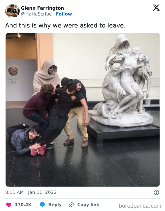 Group of people creatively imitating an iconic art sculpture by posing dramatically in a museum setting.
