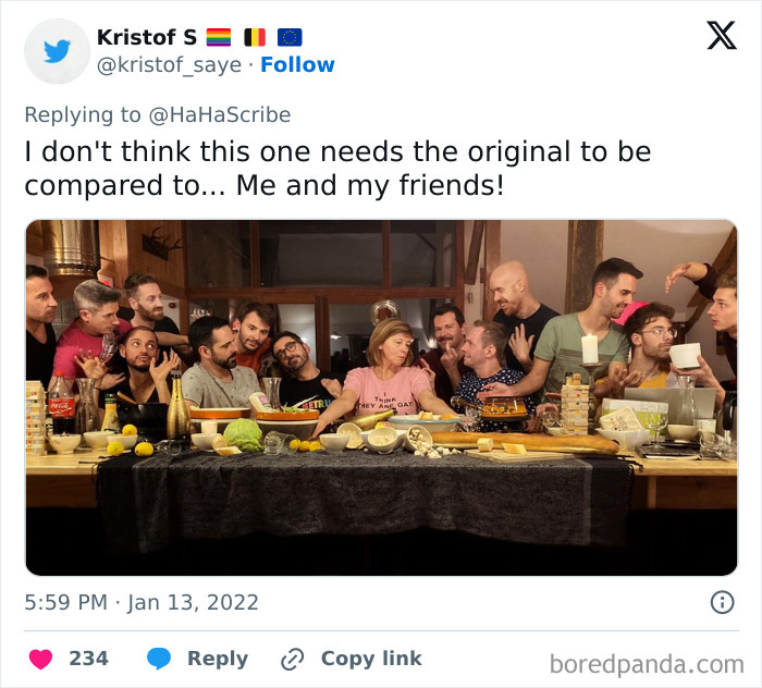 Group of people creatively imitating iconic art in a humorous pose around a table with food and drinks.