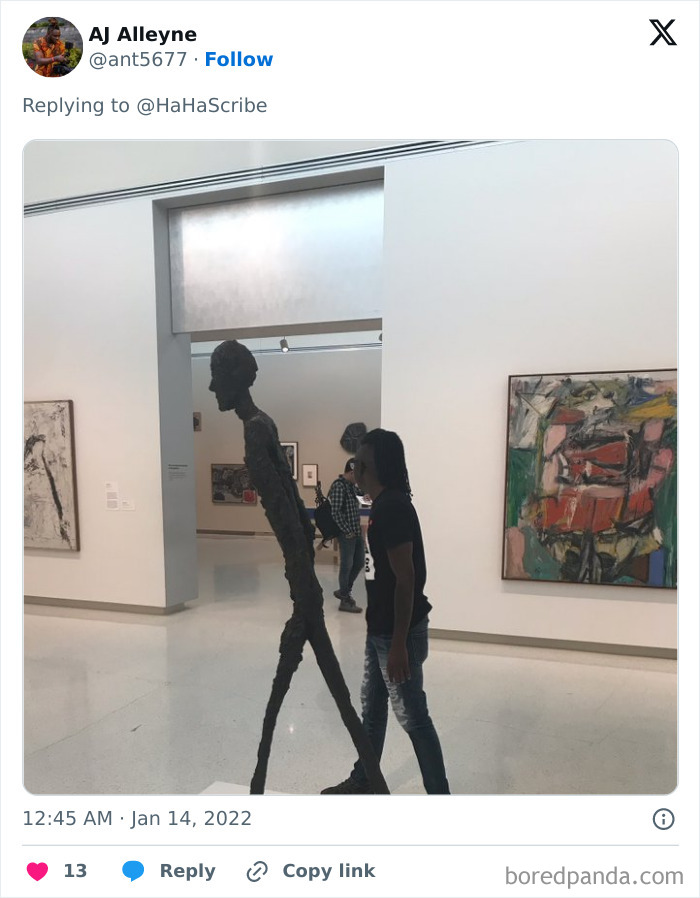 Man walking beside a tall, thin sculpture in a gallery demonstrating the concept of life imitating art.