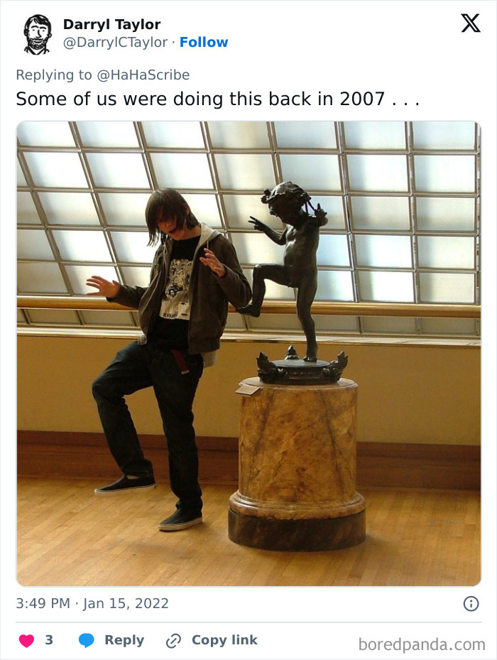 Person mimicking statue pose in a museum, illustrating life imitating art with a playful and creative gesture.