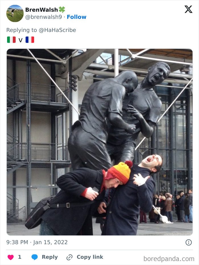 Two men mimic a life imitating art sculpture, playfully acting out the dramatic scene in a public urban setting.