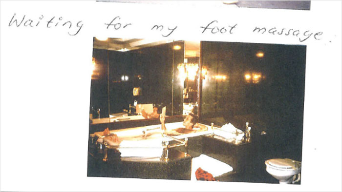 Handwritten note with a photo from Jeffrey Epstein&rsquo;s 50th birthday book showing a bathroom scene and suggestive text.