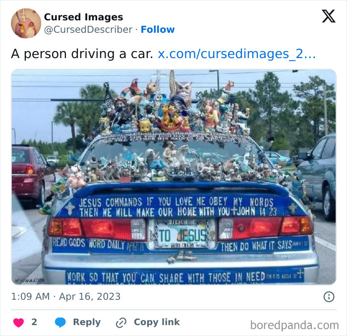 Car covered in numerous small figurines and religious messages, showcasing disturbing cursed imagery on the rear and roof.