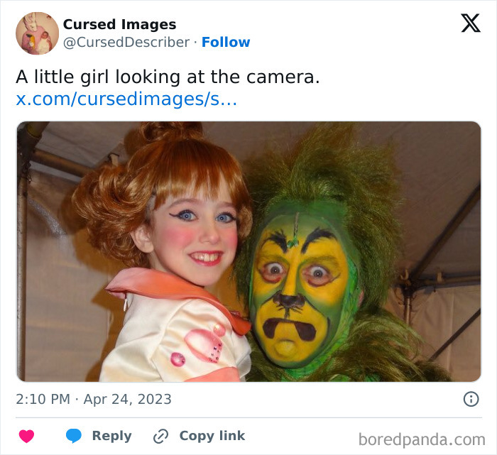 A little girl with theatrical makeup beside a person in disturbing green cursed costume and face paint.