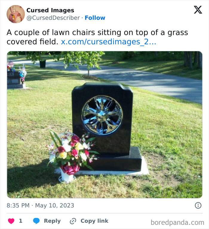 Tombstone with a shiny chrome wheel embedded, surrounded by grass and flowers, a disturbing cursed image.